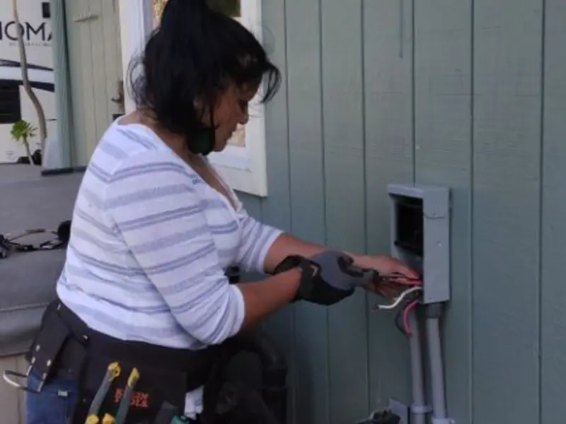 Licensed electrician wiring an exterior subpanel in Bellingham